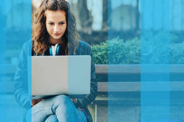 A girl taking an online assessment outdoors A girl taking an online assessment outdoors